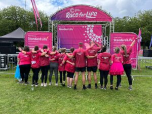 image shows staff after completing the pretty muddy challange