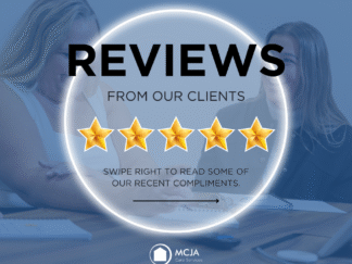 Blue image of two employees taking with a glowing circle with the word review in the middle and 5 stars