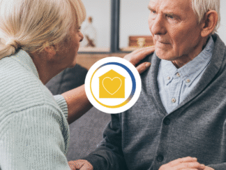Image shows a man looking confused and his career or family member possibly due to dementia
