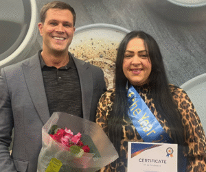 Shows Chealsea accepting Carer of the year award