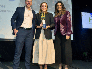 shows staff accepting an award at the HCA Awards